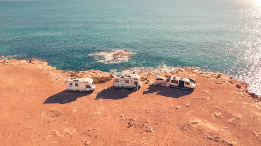 RVs by the sea on a cliff