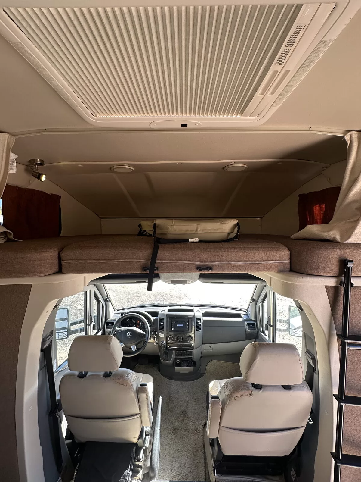 2015 Winnebago 24M Class B+ dinette and seating area at All Star Rv in Littleton, CO